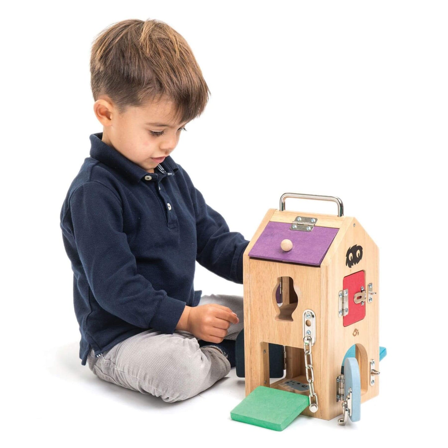 Child playing with Tender Leaf Monster Lock Box
