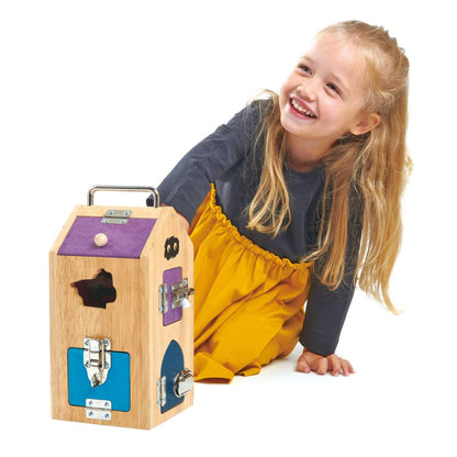 Child playing with Tender Leaf Monster Lock Box