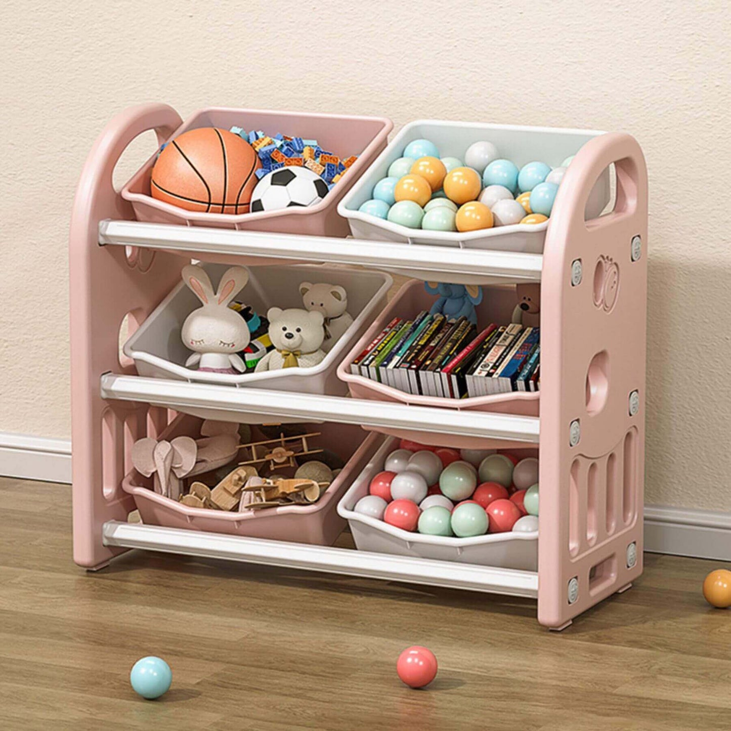 MONTARY Multi-functional Nursery Organizer with 6 Bins - Pink with various toys on a wooden floor.