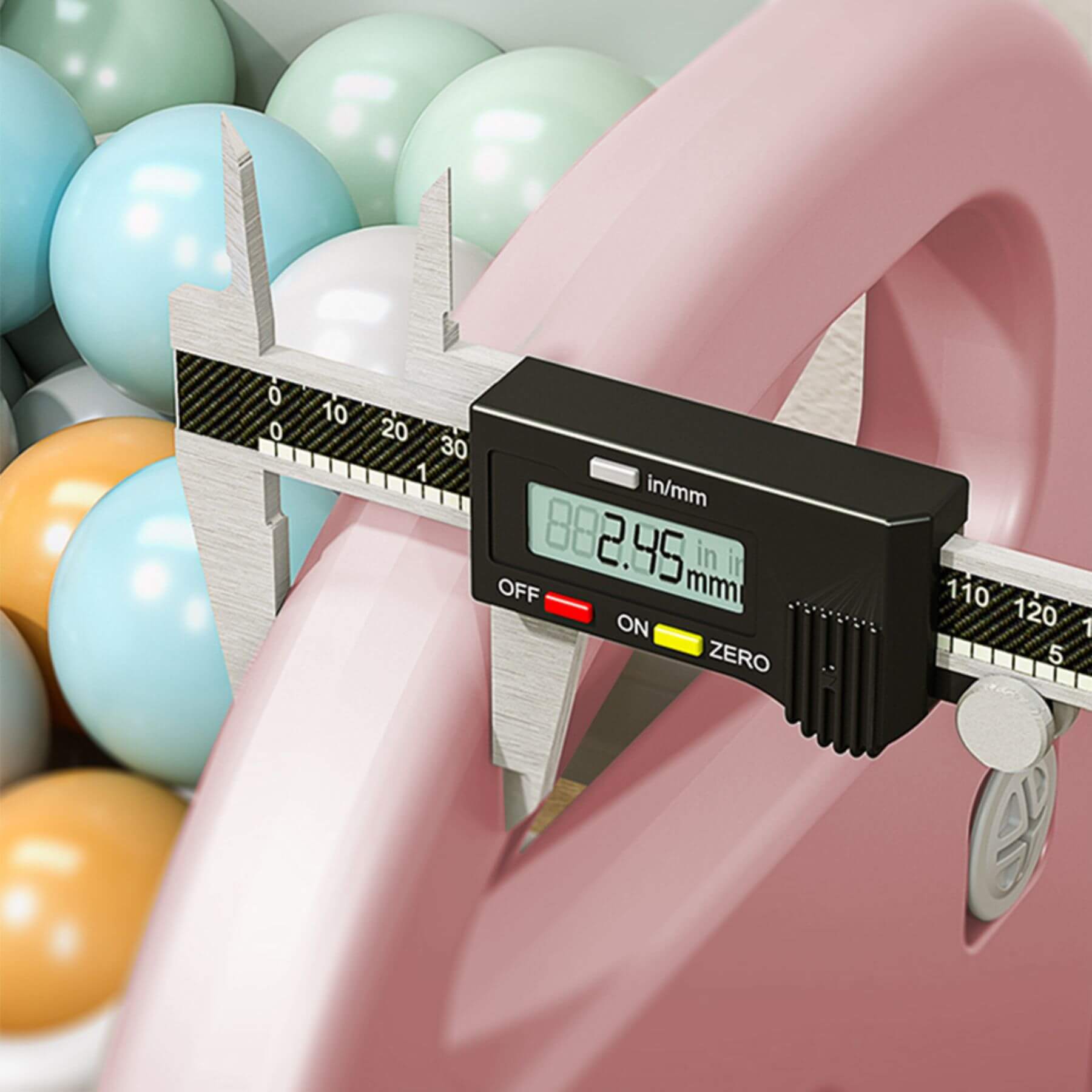 Digital caliper measuring a pink shelf with colorful balloons in the background