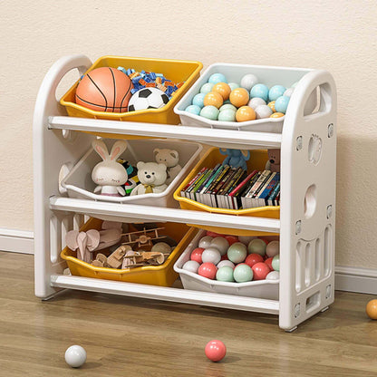 MONTARY Multi-functional Nursery Organizer with 6 Bins - Yellow with various toys and balls on a wooden floor.