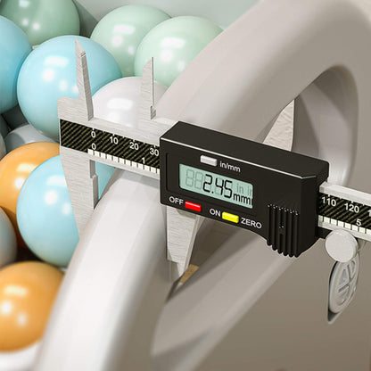 Digital caliper measuring a shelf with colorful balloons in the background