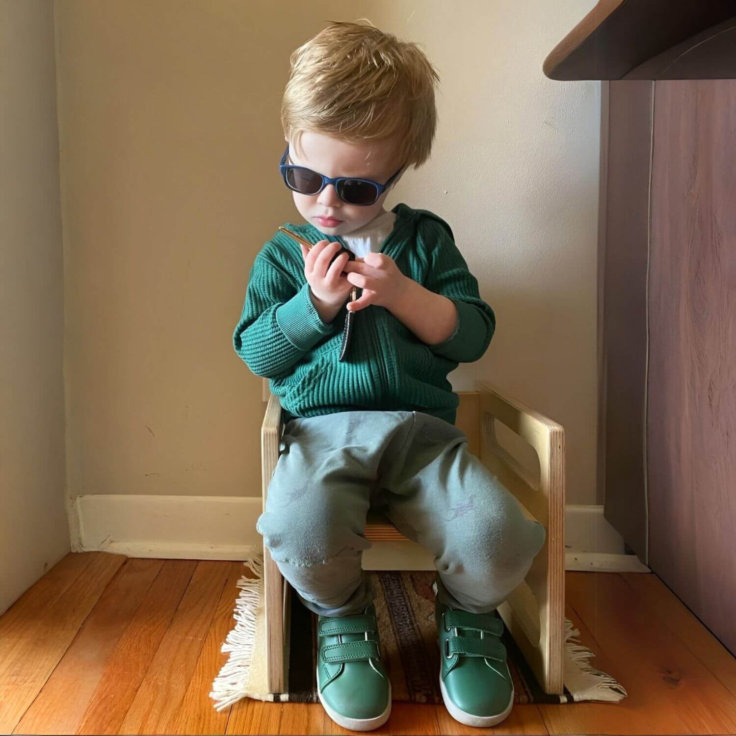 Kid Sitting on RAD Children's Furniture Montessori Cube Chair