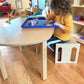 Kid Sitting on RAD Children's Furniture Montessori Cube Chair, Drawing