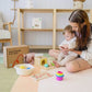Mom Holding Baby Playing Tiny Land® Montessori Toys Set for Newborns