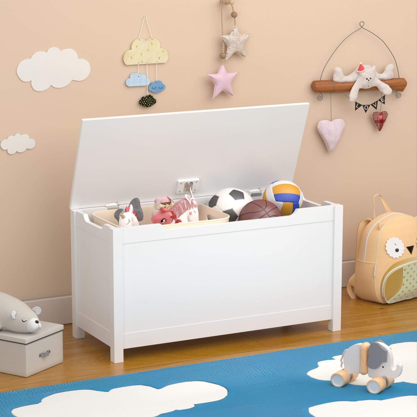 MOONRIVER Kids Wooden Toy Box Storage with Safety Hinged Lid - White with toys inside, placed on a wooden floor with decorative elements on the wall.
