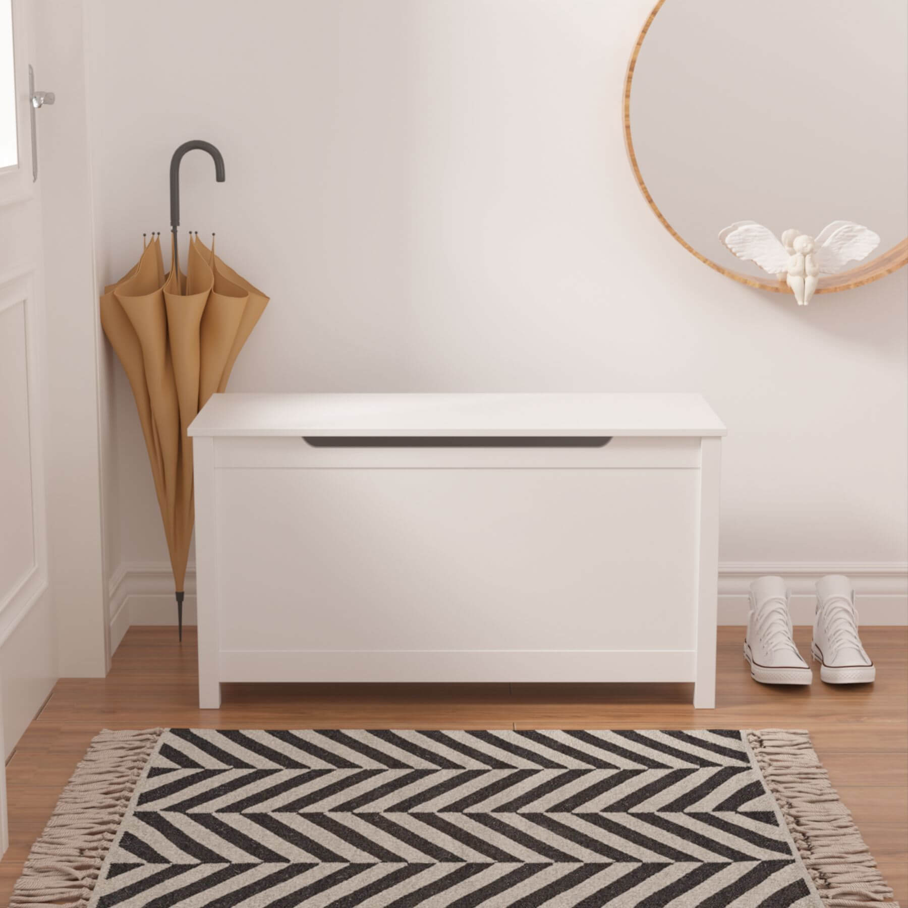 MOONRIVER Kids Wooden Toy Box Storage with Safety Hinged Lid - White in a room with a black and white zigzag rug, brown umbrellas, and white shoes.