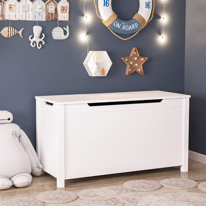 MOONRIVER Kids Wooden Toy Box Storage with Safety Hinged Lid - White in a room with nautical-themed decorations on the wall.