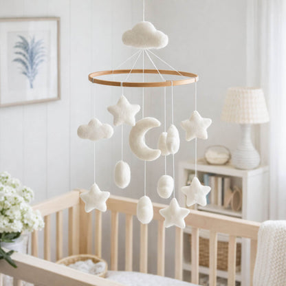 Ganapati Crafts Co. Moon & Stars Baby Mobile hanging above a crib in a nursery.