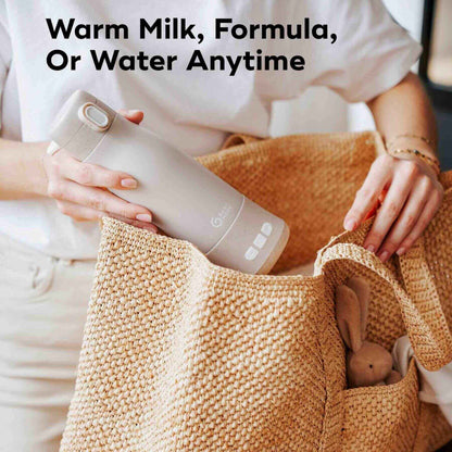 Person holding Moov & Feed Portable Milk and Water Warmer with text about warm milk, formula, or water anytime.