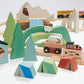 Wooden toy set with animals, trees, and vehicles on a white background