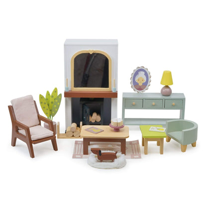 Dollhouse living room set with furniture and fireplace on a white background
