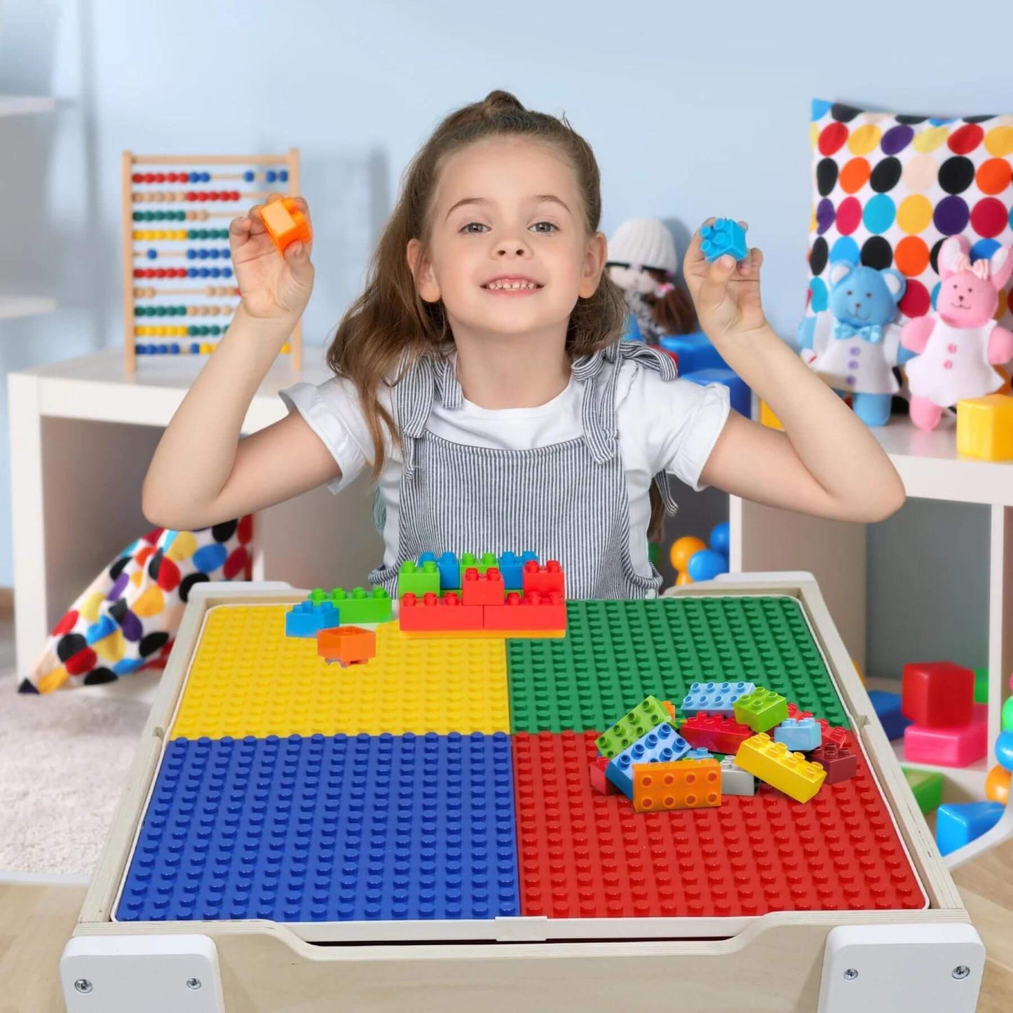 Kid Playing at Teamson Kids Multi-Activity Table with Reversible Tabletop & Chairs Set White