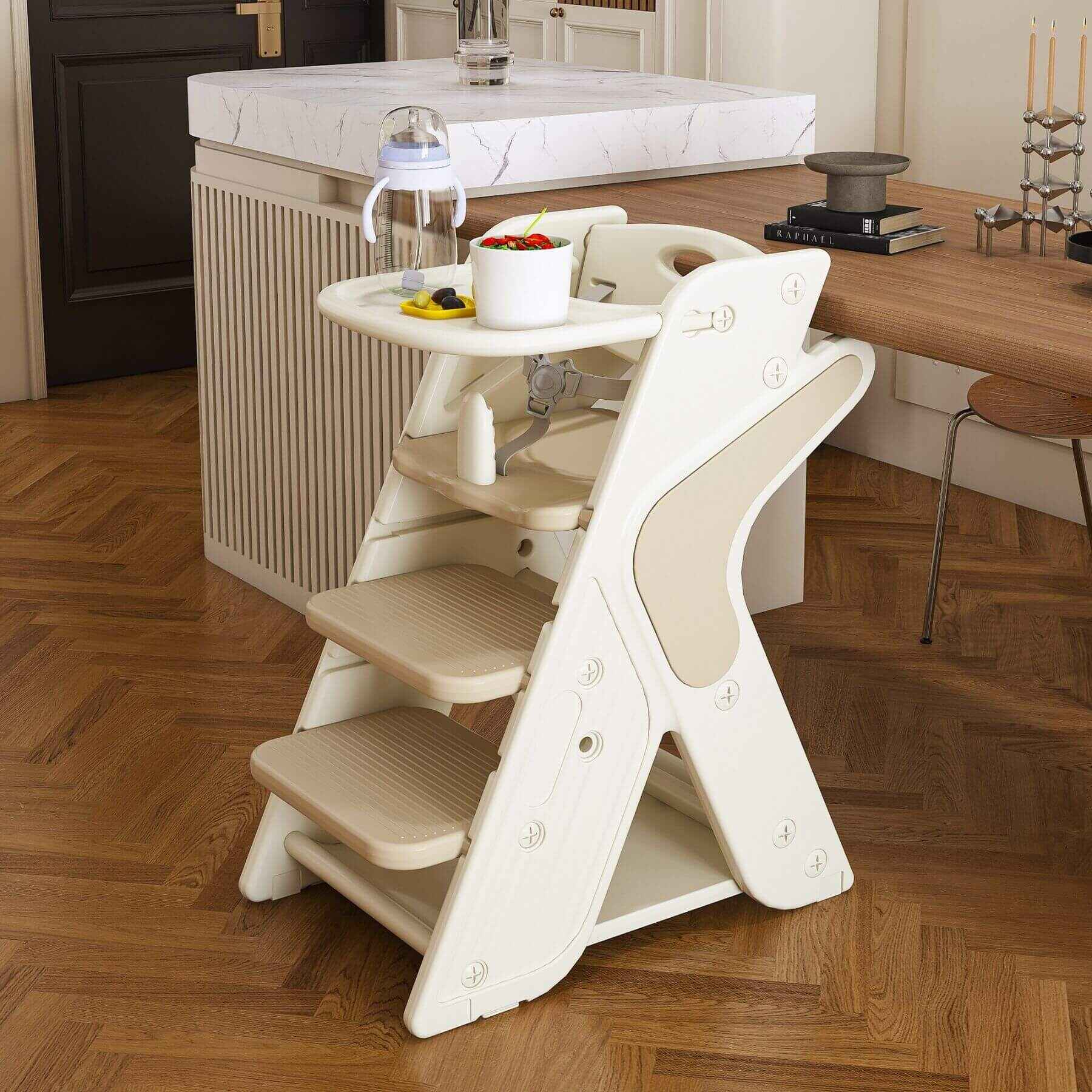 Multi-Functional Growing Up Dining Chair - White & Charcoal in a kitchen setting with a marble countertop and wooden floor.