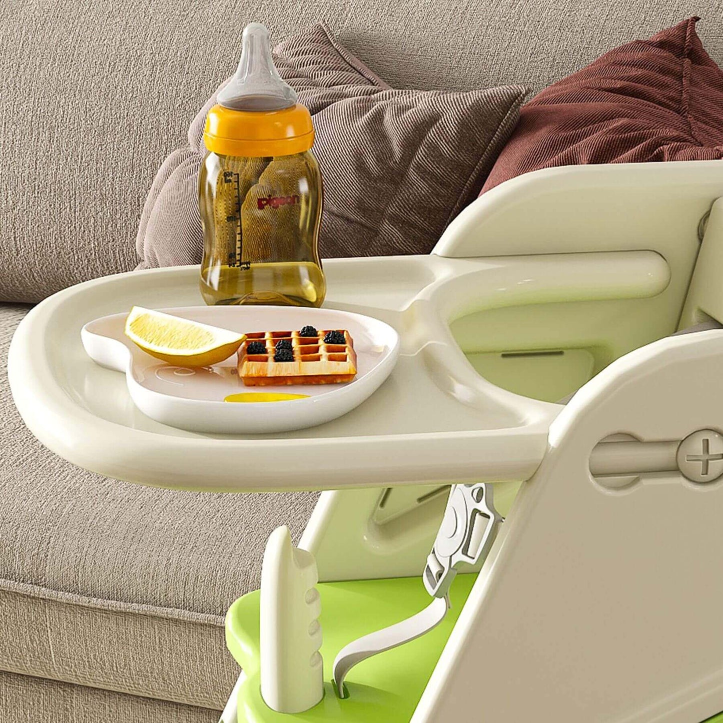 Multi-Functional Growing Up High Chair, - White & Green holding a bottle, lemon, and waffles on a couch background