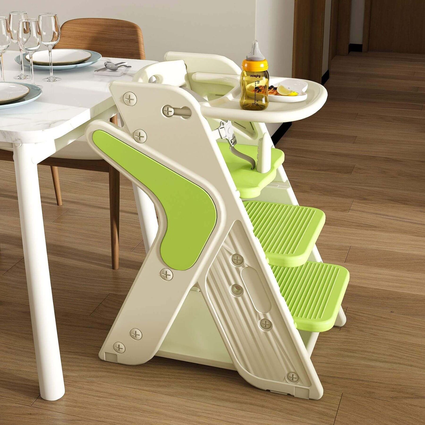 Multi-Functional Growing Up High Chair, - White & Green on a wooden floor next to a dining table.