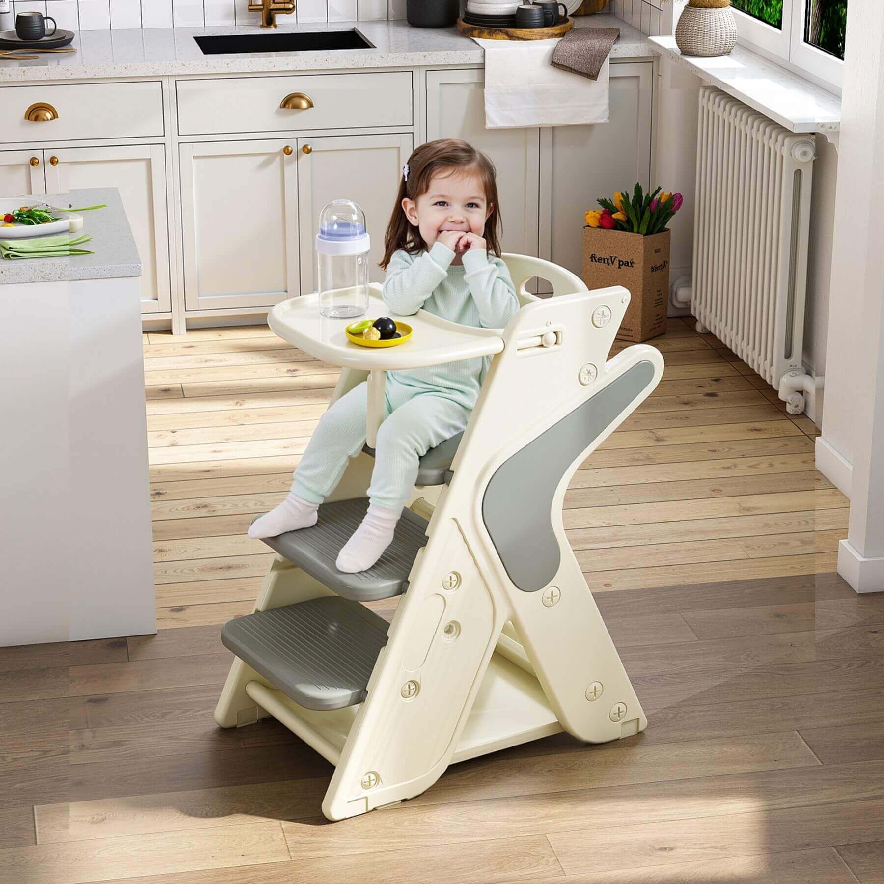 Child sitting on Multi-Functional Growing Up High Chair -  Grey & White in a kitchen
