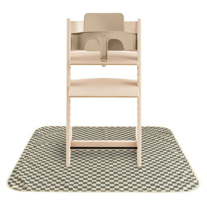 Wooden high chair on Mushie Splat Mat - Olive Check