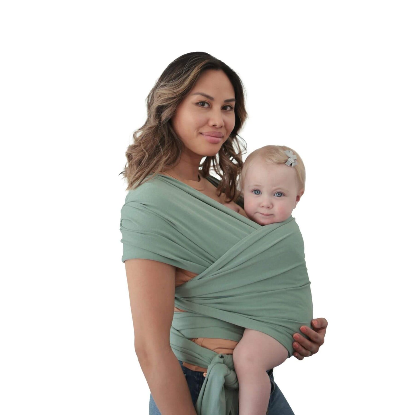 Woman holding a baby wrapped in Mushie Baby Wrap Green