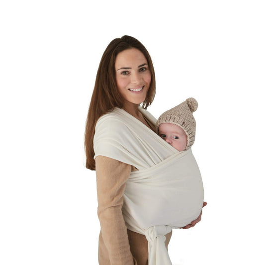 Woman holding a baby Mushie Baby Wrap Ivory
