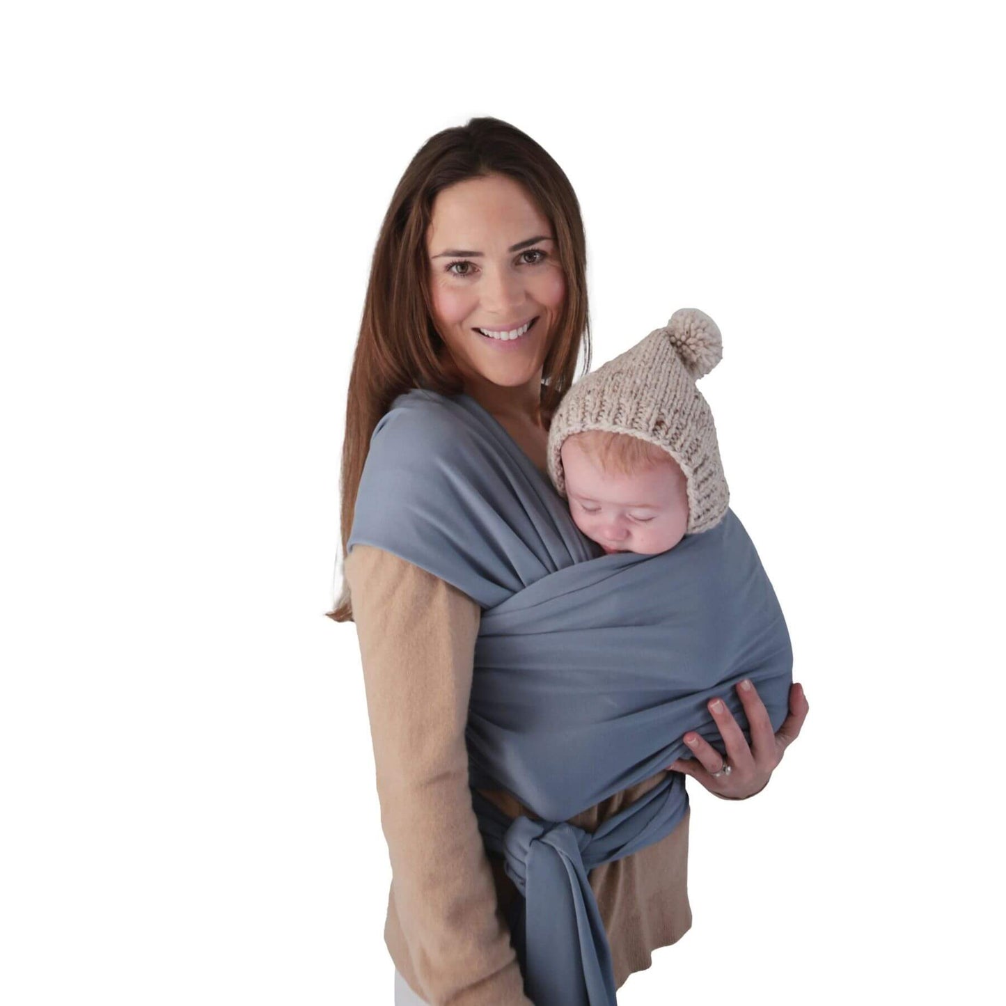 Woman holding a baby in Mushie Baby Wrap Tradwinds