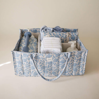 Mushie Diaper Caddy with baby items
