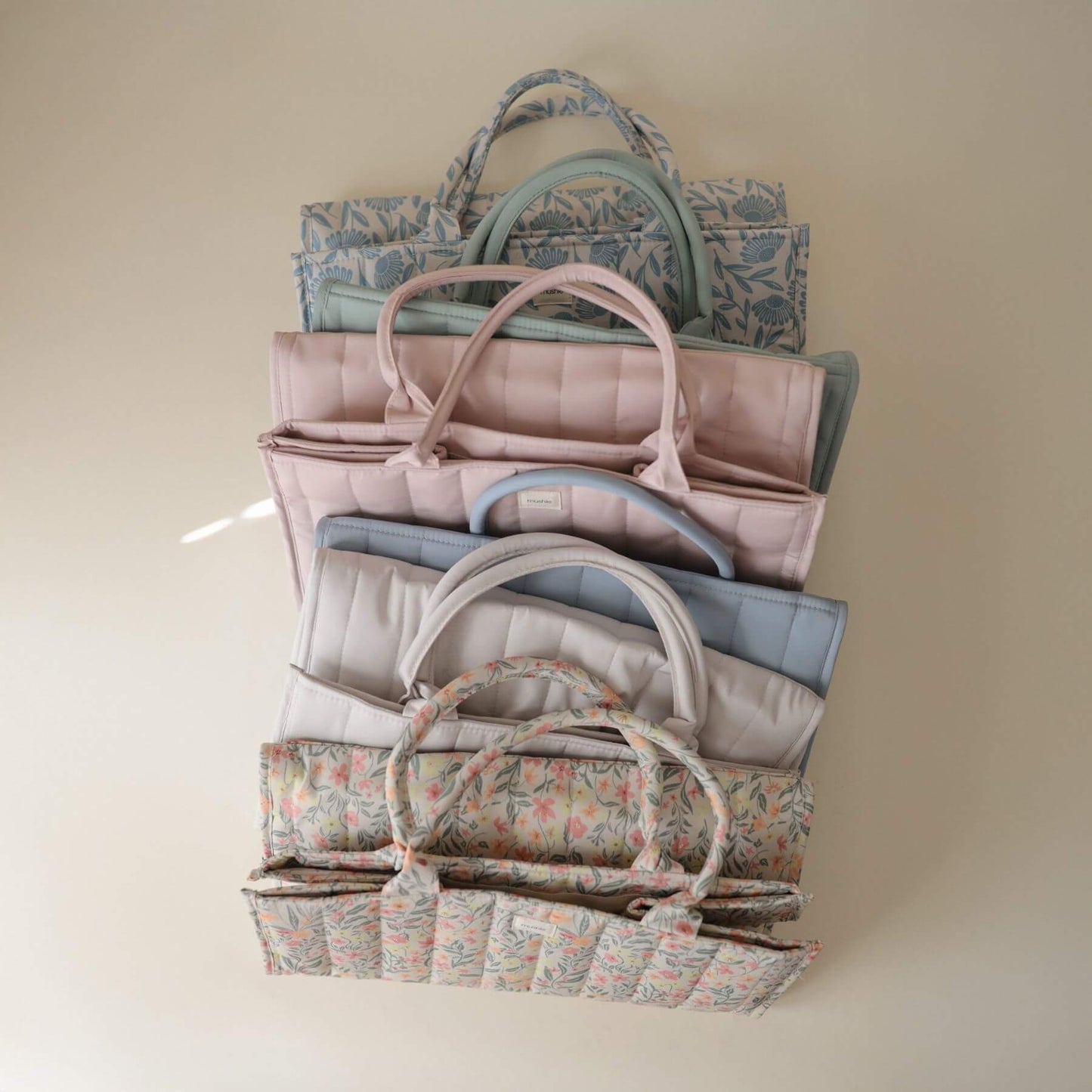 Multiple Mushie Diaper Caddy in different colors