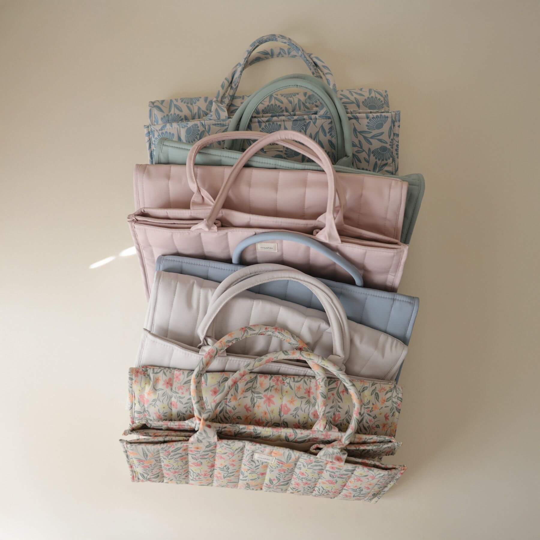 Multiple Mushie Diaper Caddy in different colors