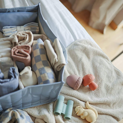 Mushie Diaper Caddy with baby items