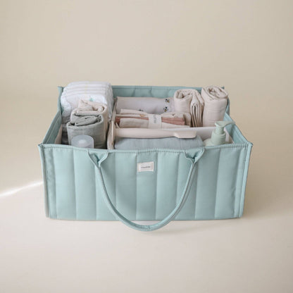 Mushie Diaper Caddy with baby items
