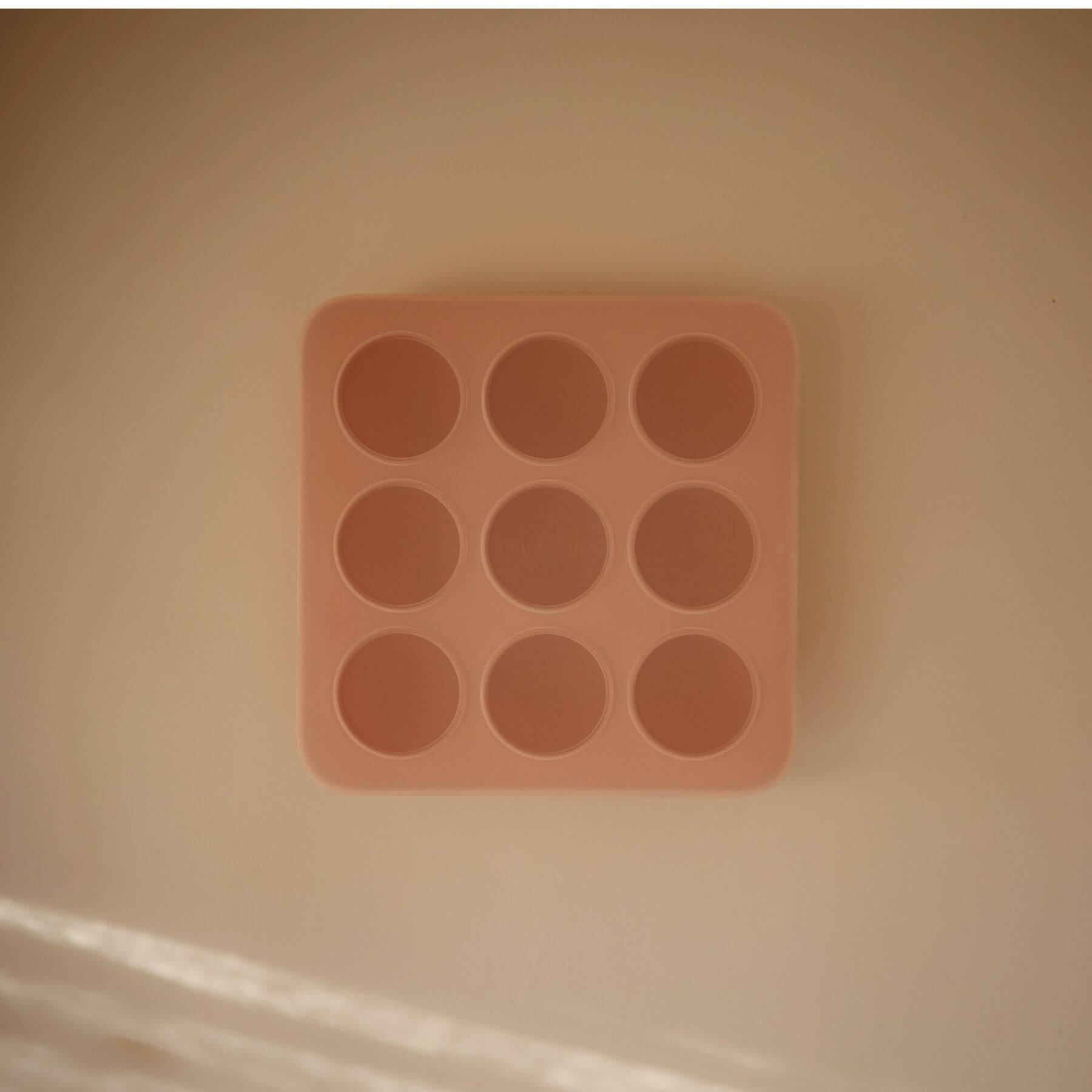 Mushie Baby Food Freezer Tray on a beige background