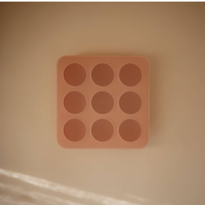 Mushie Baby Food Freezer Tray on a beige background