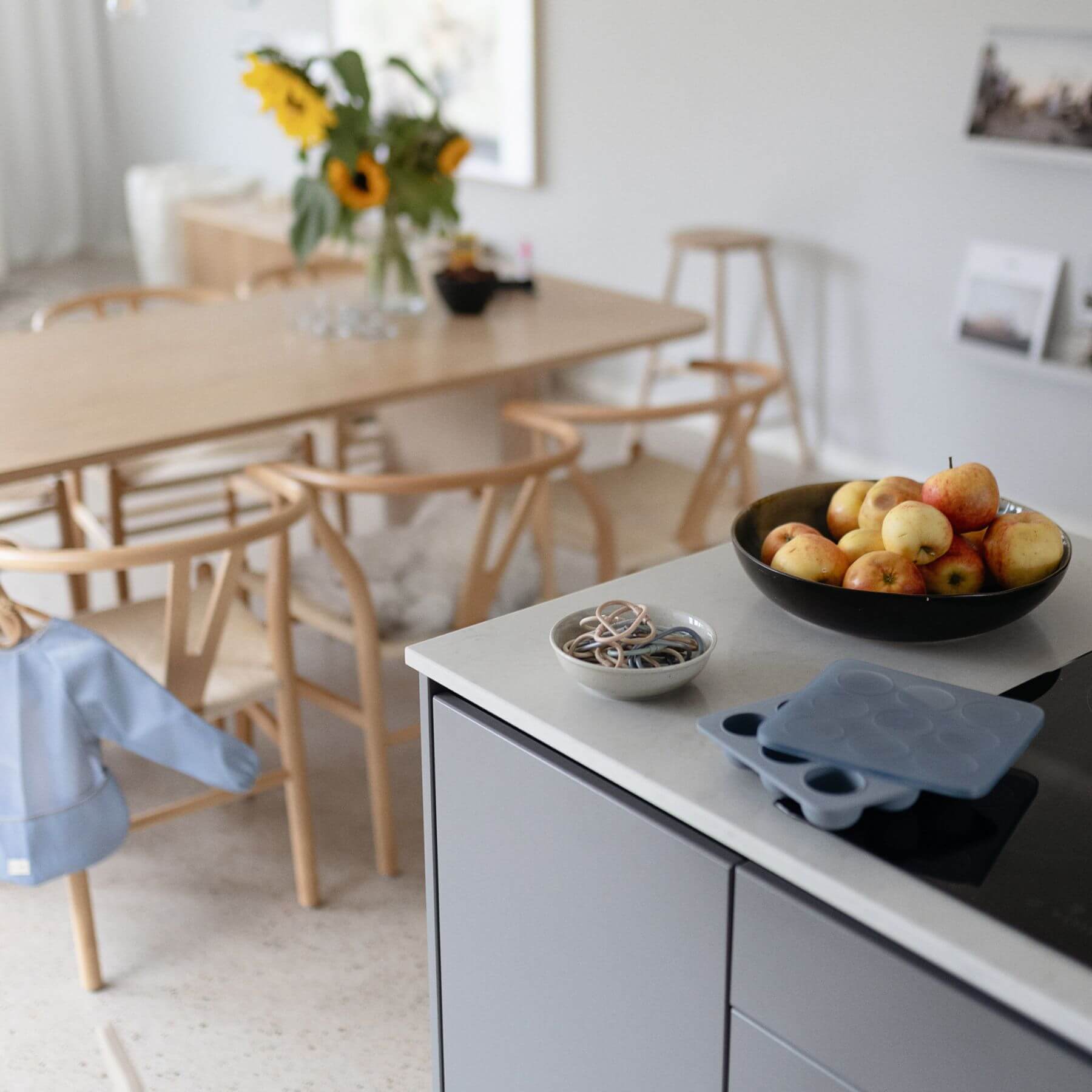 Modern kitchen with a dining area in the background