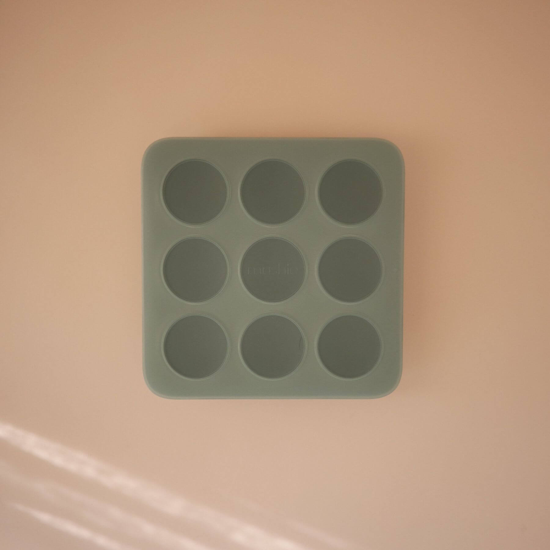 Mushie Baby Food Freezer Tray Cambridge Blue on a beige background