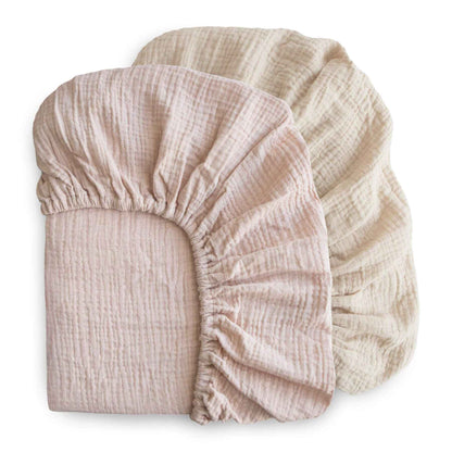mushie two fabric fitted sheets stacked