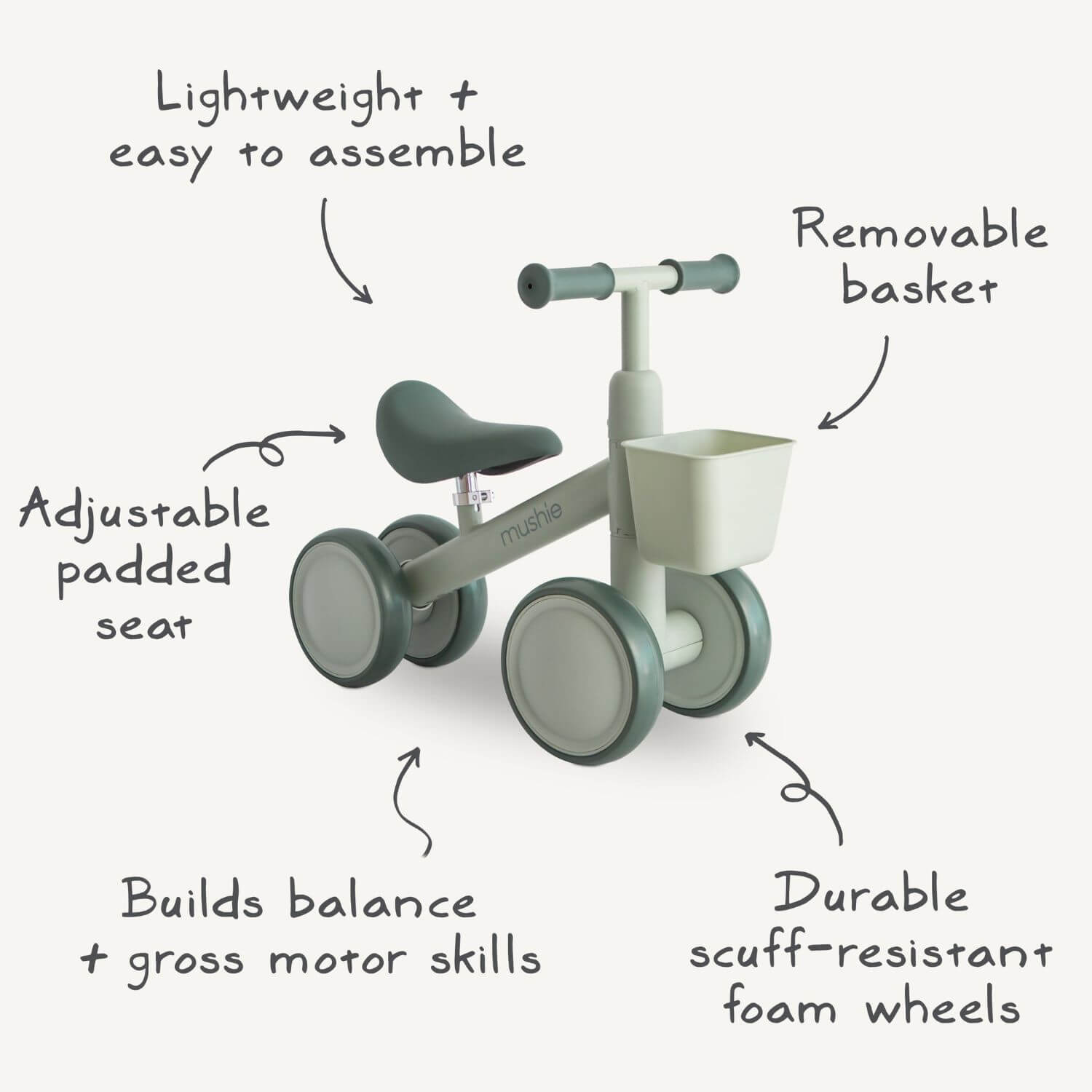 Mushie Mini Toddler Bike with feature callouts on a light gray background