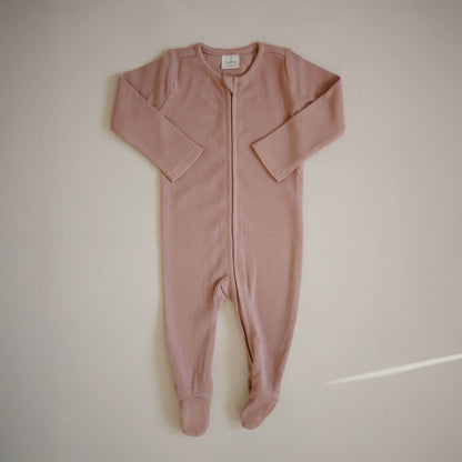 Mushie Zipper Pajama - Blush, laid flat on a light beige background.