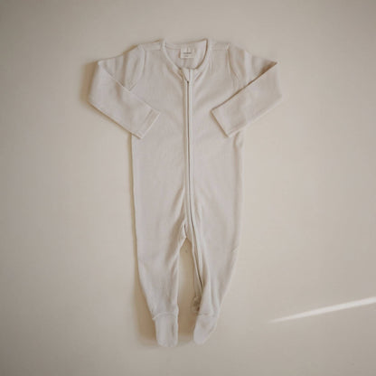 Mushie Zipper Pajama - IVory on a beige background