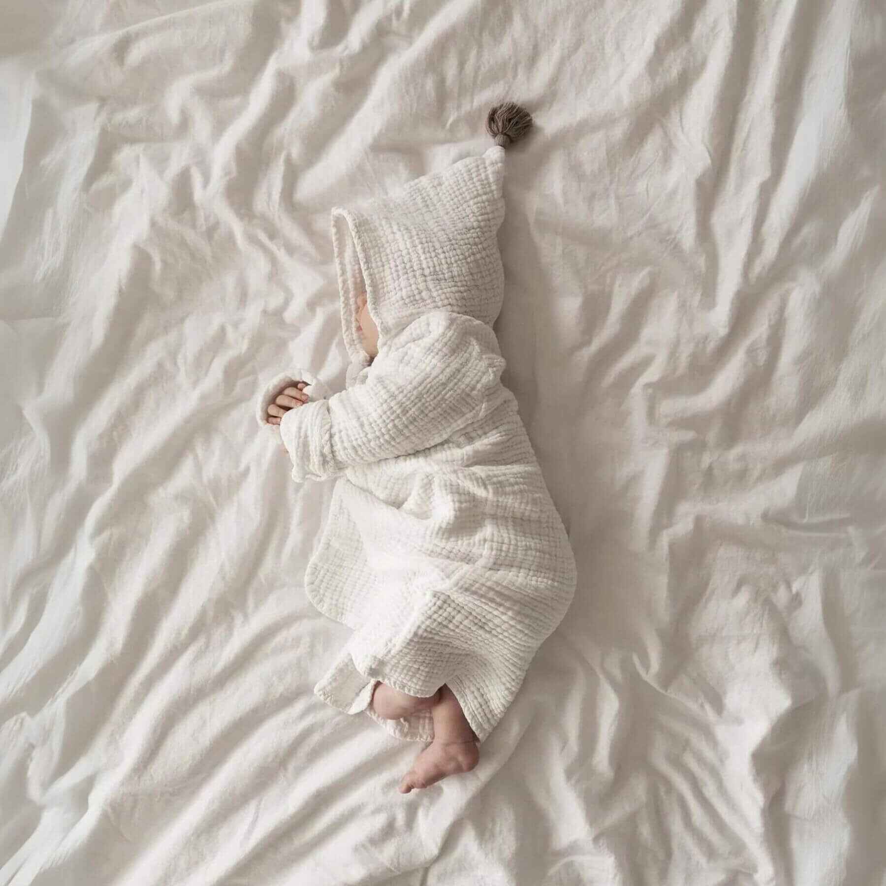 Baby Sleeping in Unique Love Design Muslin Bathrobe Cloud White