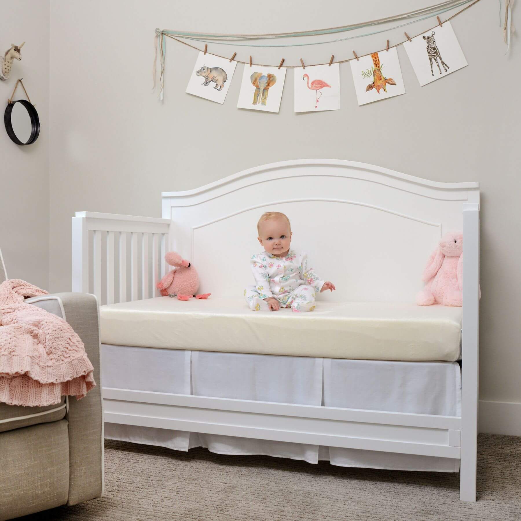 Baby Sitting on My First Memory Foam Crib Mattress with Waterproof Cover