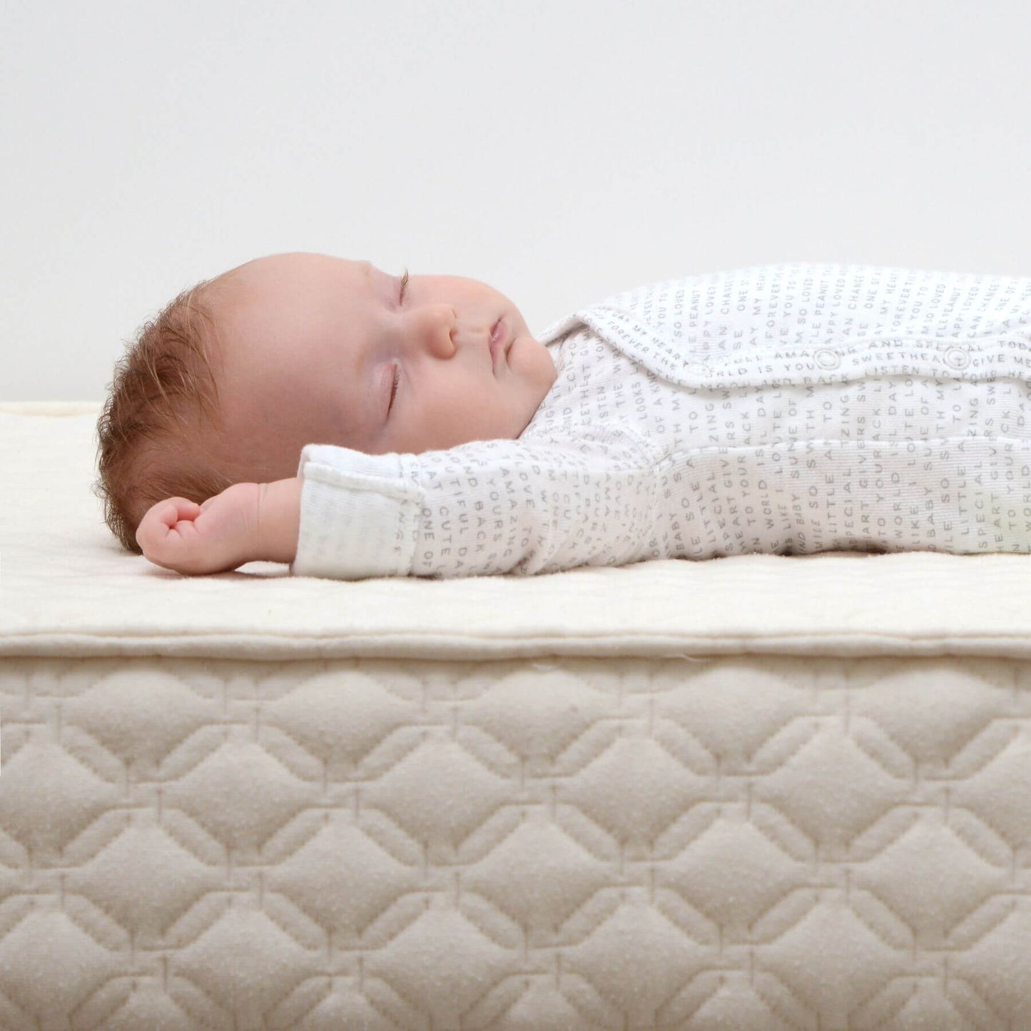 Baby Sleeping on My First Quilted Crib Mattress