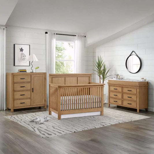 Nursery room with Mystic collection furniture including a crib, dresser, and changing table.