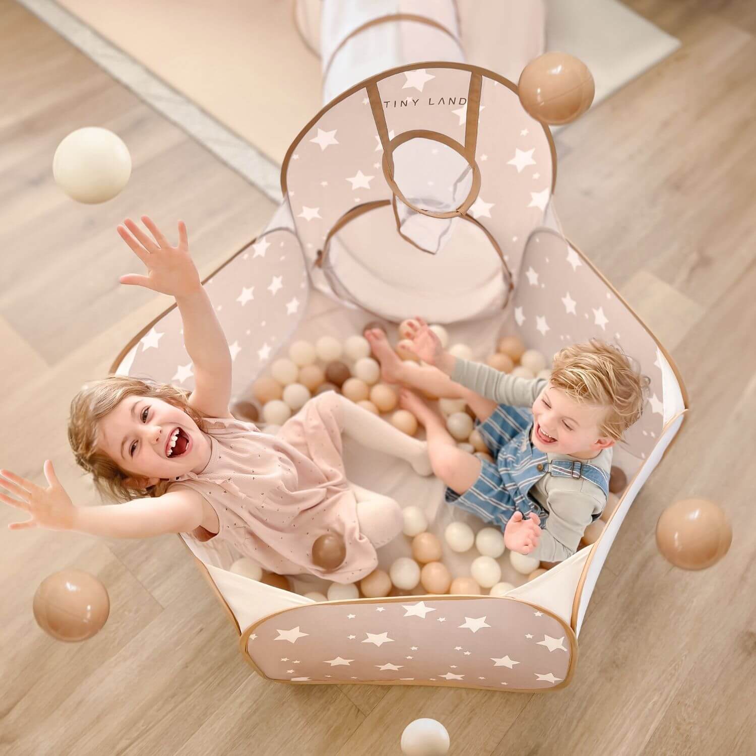 Kids Playing Tiny Land® Ocean Ball in Play Tunnel