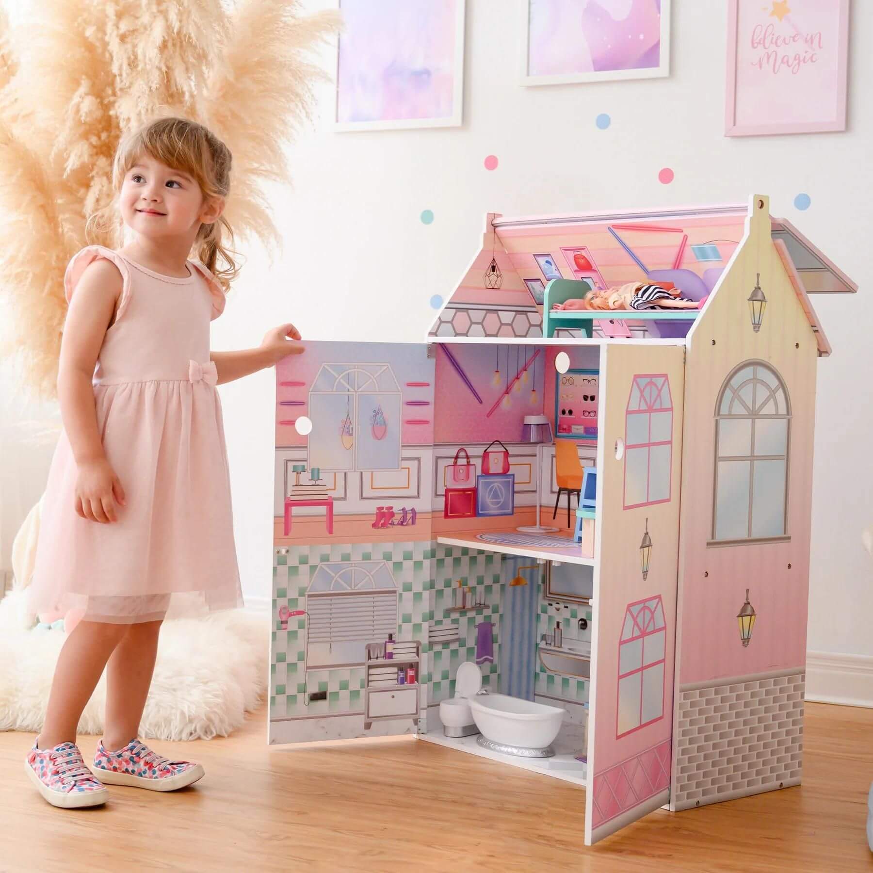 Girl Playing with Olivia's Little World Dreamland Glass-Look Dollhouse