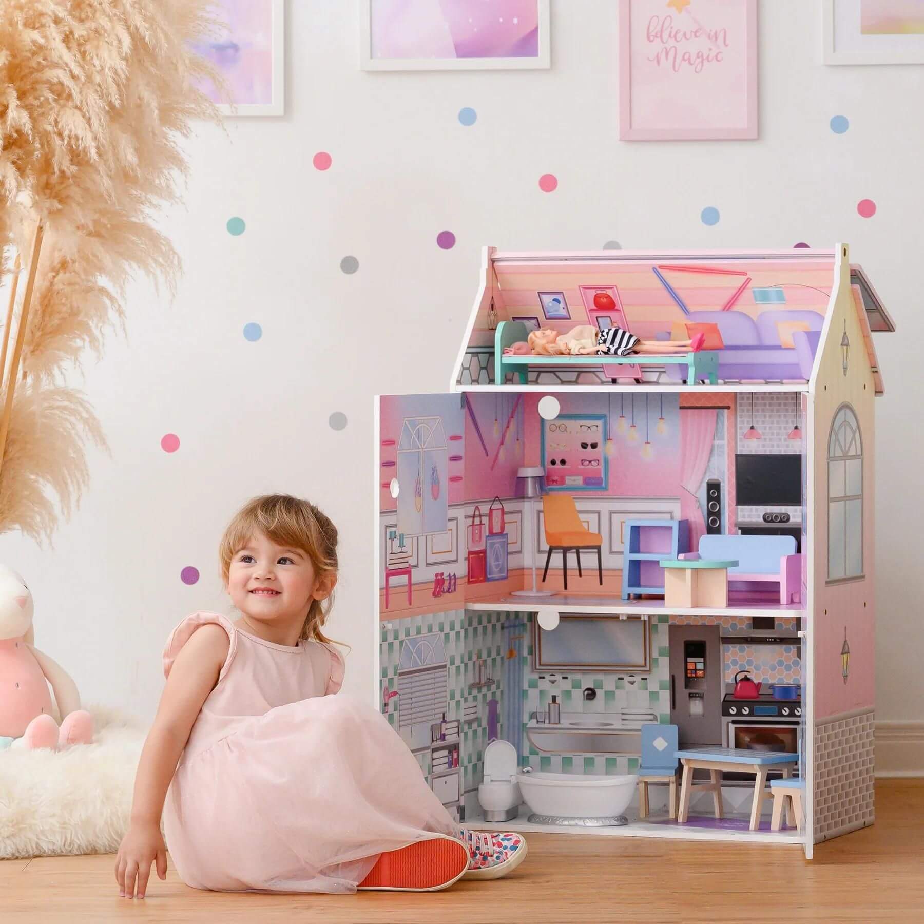 Girl Playing with Olivia's Little World Dreamland Glass-Look Dollhouse