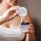 Mom Pouring Breastmilk into a Container