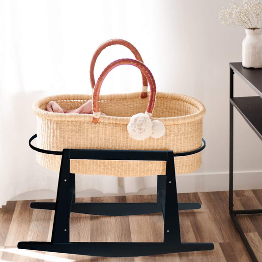 Wicker Moses basket with Plum+Sparrow Original Rocking Moses Bassinet Stand with brake Black on a wooden floor