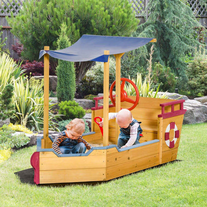 Outsunny Pirate Ship Sandbox - Orange in a garden setting.