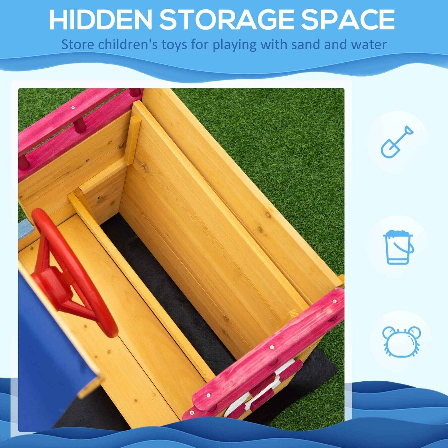 Wooden sandpit with red handle and pink sides on grass, labeled 'Hidden Storage Space'.