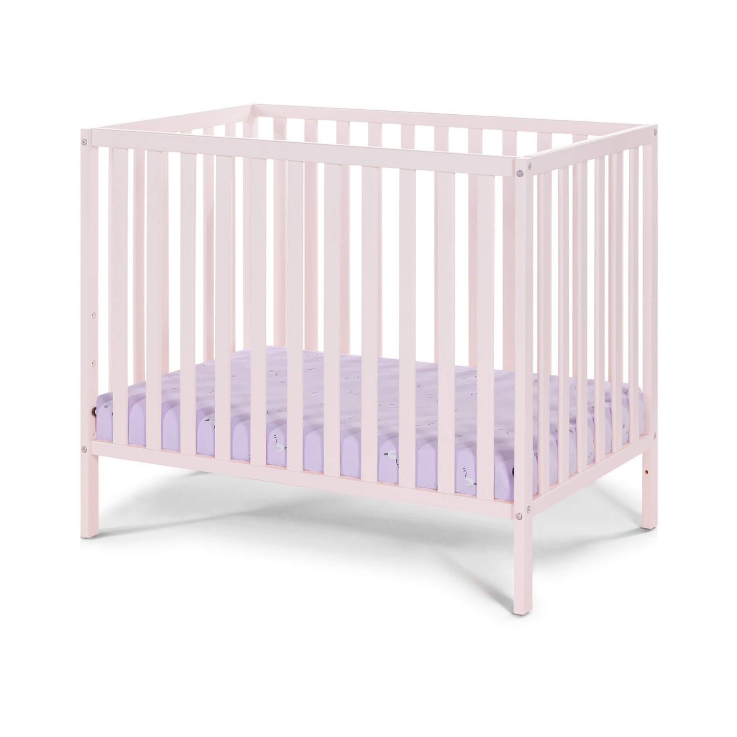 Palmer 3-in-1 Convertible Mini Crib Pastel Pink with a purple mattress on a white background